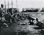 Japanese Army atop the Xiaoximen (Small Western Gate) of the inner city walls of Mukden (now Shenyang), Manchuria, China From (Manshu Jihen Shashincho)